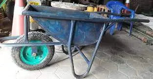 a blue wheelbarrow with green wheels
whelbarrow fit in a car