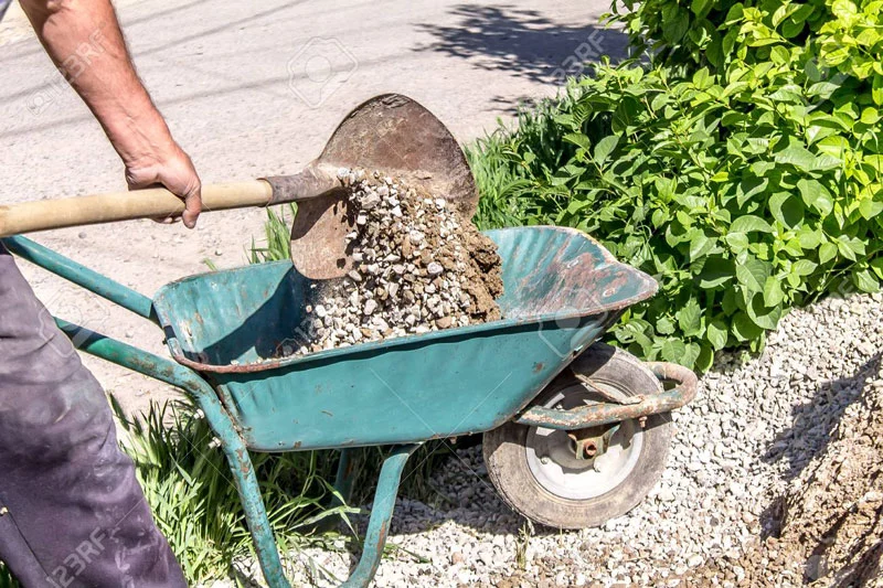uses of wheelbarrow in the garden
a wheelbarrow filled with dirt